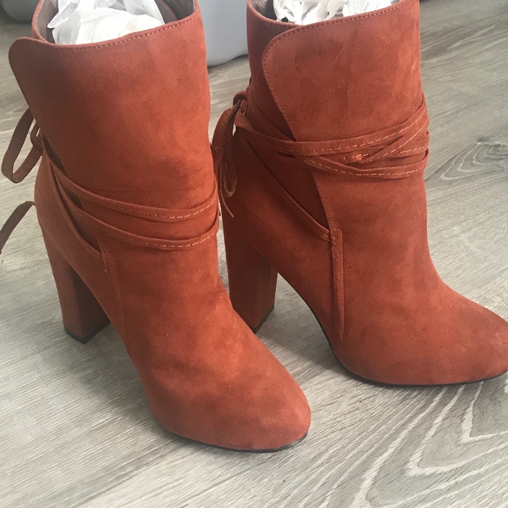4 inch heel suede like boots.  NEVER WORE